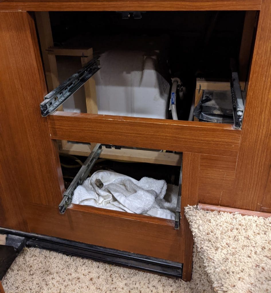 replacing rv water heater: removing bedroom drawers to access the back of the water heater