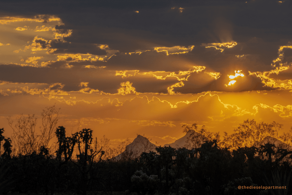I Thought This Rv Park Was A Pit Stop. It Became Home. 3 sunset with storm clouds, a desert landscape, and mountains