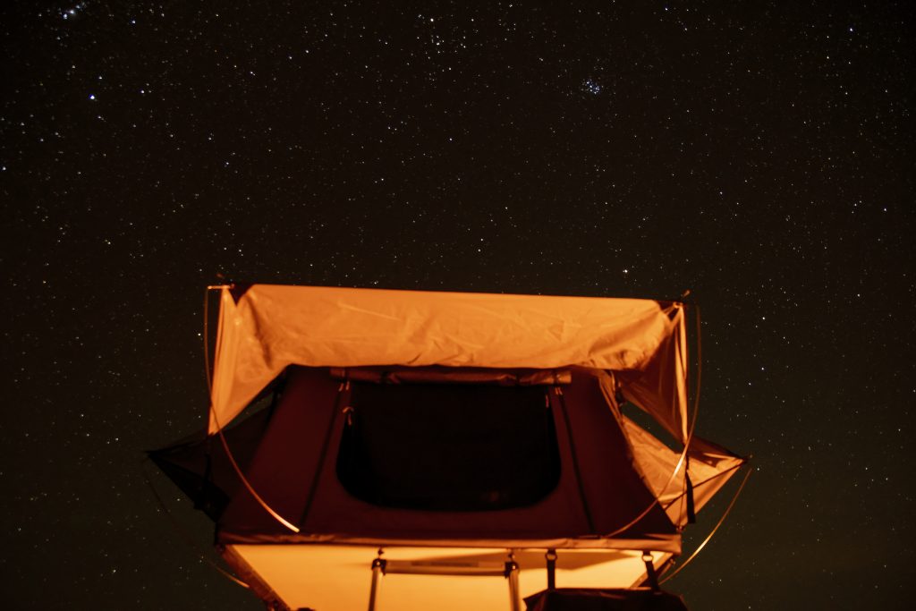 This Free Camping Area Outside Tucson Feels Like Sleeping In A National Park 4 tent illuminated under starry night sky