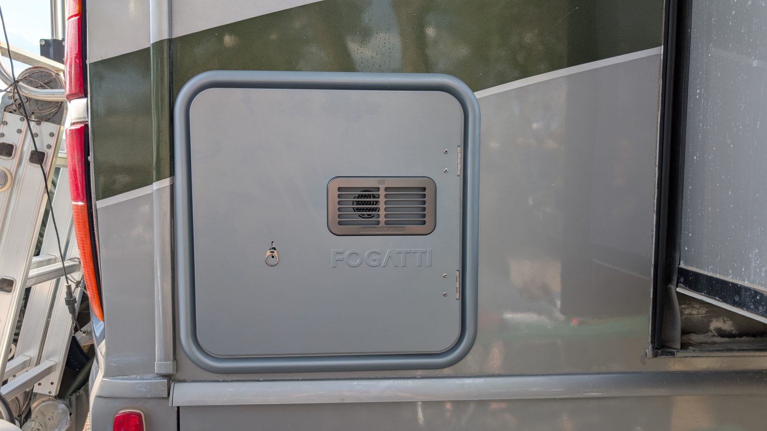 Our Rv Water Heater Failed (Again), So We Went Tankless 4 exterior panel of a tankless water heater